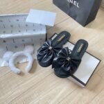 Chanel Bow Embellished Slides In Black - Image 3
